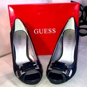 Like new black Guess peep-toe pumps. Heels/sole is excellent shape